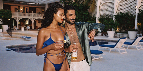 Model wearing Sommer Swim royal blue bikini near by pool 