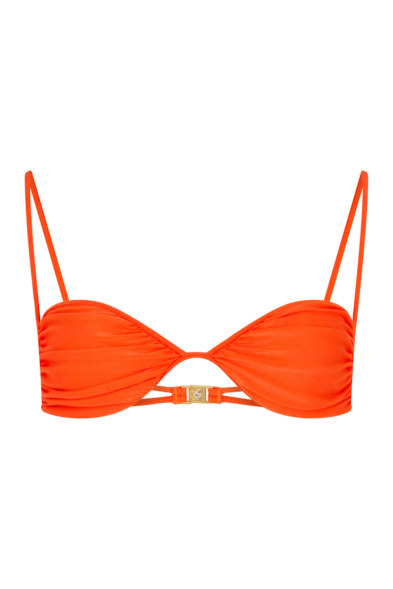 An orange bralette bikini top with adjustable straps and ruched cup detail, featuring brushed vintage gold hardware.