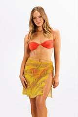 Model wearing NIA wrap skirt – tropical beach look