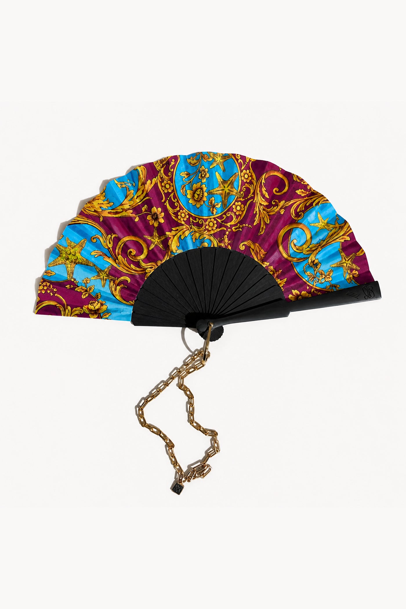 Decorative fan with colorful baroque pattern on a white background