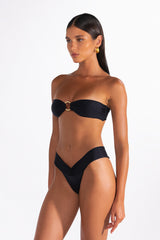 Strapless black bandeau bikini top with tie-back and gold accent